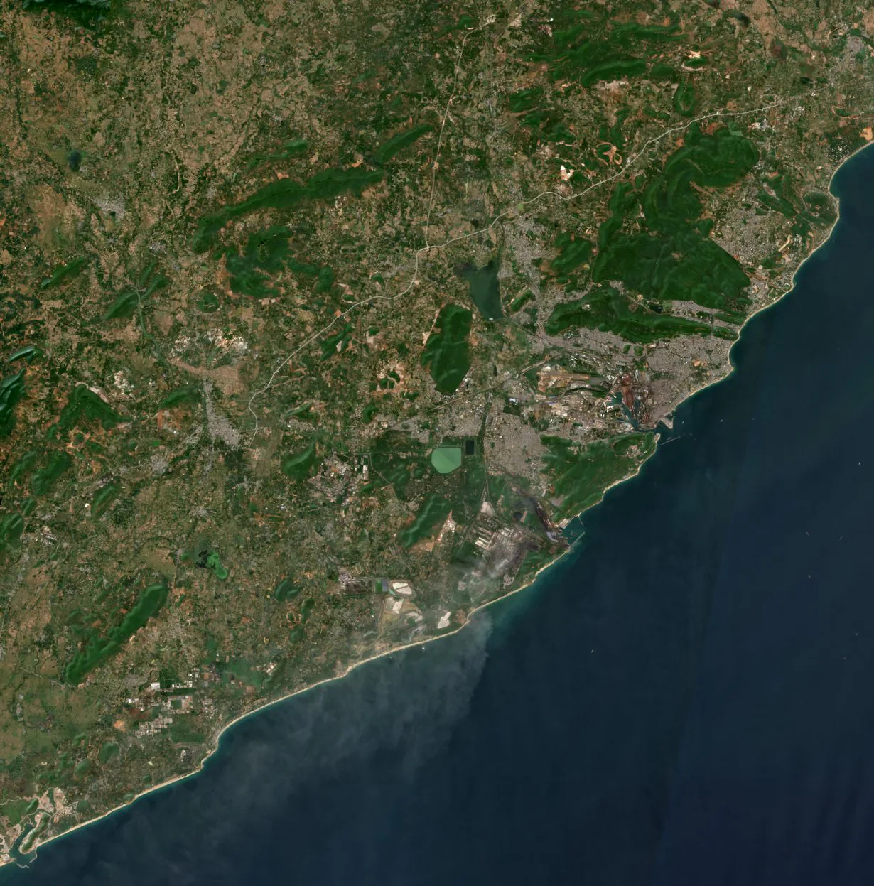 Satellite image of the Visakhapatnam coast showing the three data-centre sites: Tarluvada north of the city, Adavivaram at its northern edge, and Rambilli on the coast to the south-west.